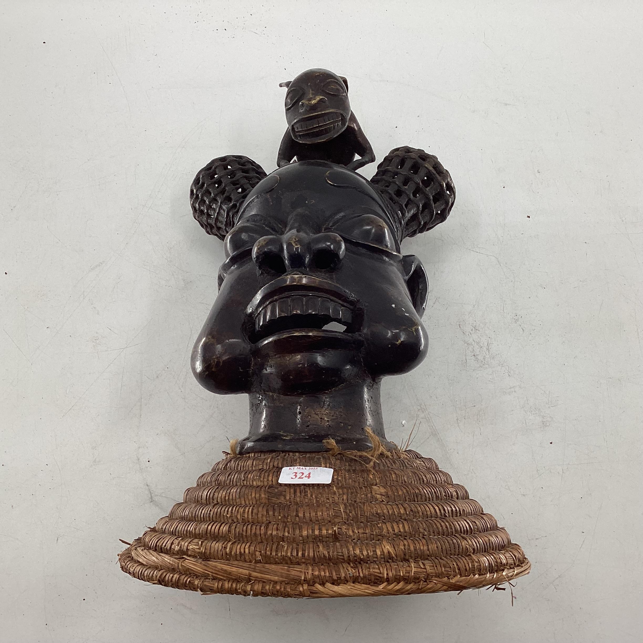 Mid to late C20th West African cast metal item depicting tribal chief topped with mythical