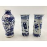 A pair of Chinese blue and white tube vases with flared rim and a blue and white baluster shaped