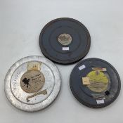 A collection of Mid Century film cannisters with related content to include "The Royal Marines