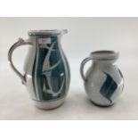Alan Caiger-Smith, two water jugs of similar design 27cm H and 19cm H monogrammed to base;
