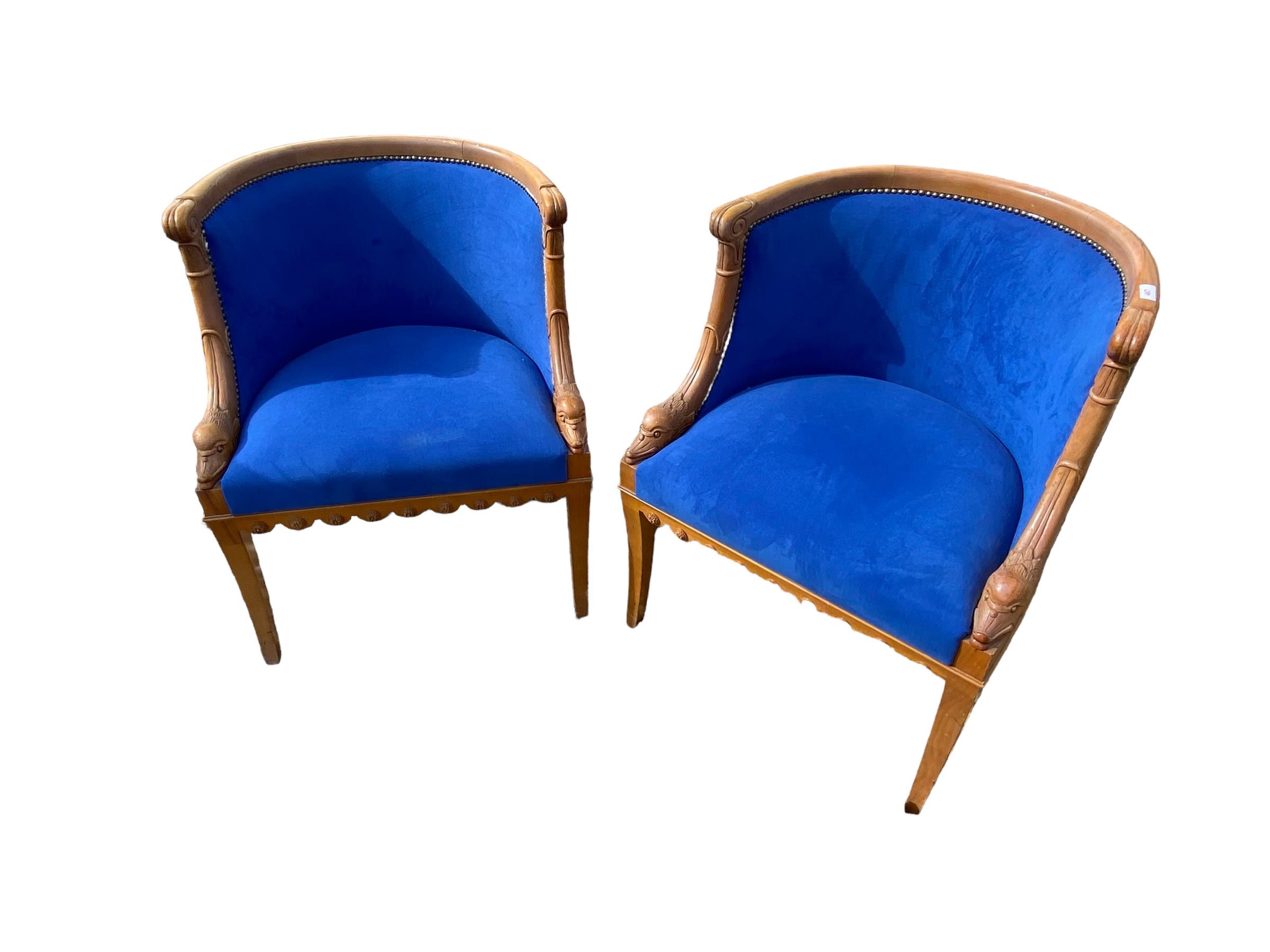 Pair of French walnut tub chairs, with studded blue upholstery, swan decoration, on square legs,