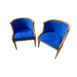 Pair of French walnut tub chairs, with studded blue upholstery, swan decoration, on square legs,