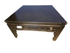 A C19th style Chinese square black lacquered low table, carved and pierced frieze on square legs, 98