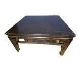 A C19th style Chinese square black lacquered low table, carved and pierced frieze on square legs, 98