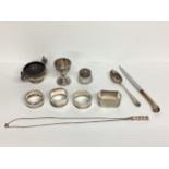 Collection of Sterling silver items to include napkin rings, egg cup, 216g silver, and a silver