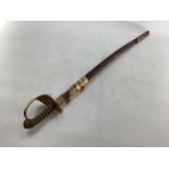 A C19th naval officers dress sword, shagreen wired grip, lion head pommel, and gilt metal basket,