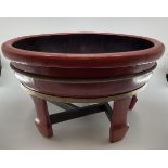 A C19th style Chinese Brass bound lacquer bath or planter circular form, with wide flat bottom