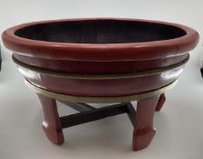 A C19th style Chinese Brass bound lacquer bath or planter circular form, with wide flat bottom