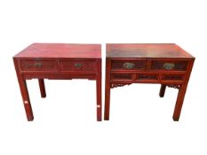 A pair of Chinese red lacquer carved wooden writing desks, two short drawers, carved and pierced