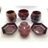 A pair of Chinese hexagonal hardwood dishes together with three lacquered vases of bulbous form, and