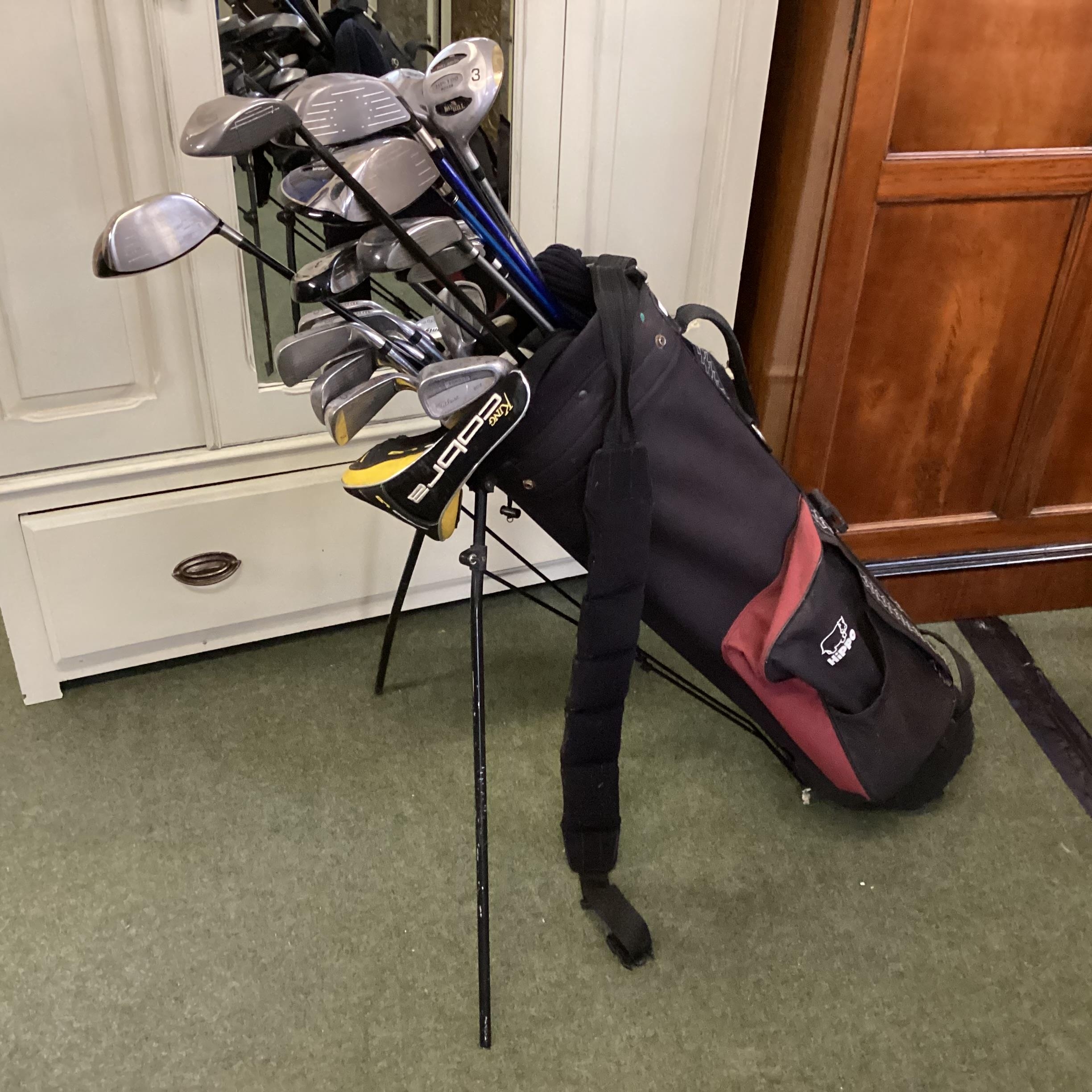 A quantity of golf clubs (for left hand players), as found