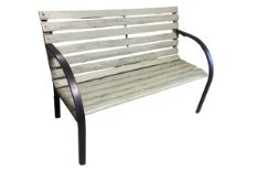 A green slatted garden two seater bench with black coloured arms and legs, lightweight, some wear,