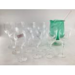 ORREFORS, a set of 12 wine glasses, eight small and four large with faceted bowls and plain stems