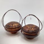 A pair of Chinese C19th style lacquer lidded rice boxes of circular form with gilt decoration and