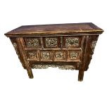 A C19th style Chinese hardwood Alter cabinet, three single drawers, carved decoration and frieze and