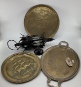 Three large copper trays, 1 with loop handles and work silver plating, together with gothic style