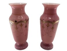 Pair of early C20th pink vases with gilt decoration and circular foot 30c,