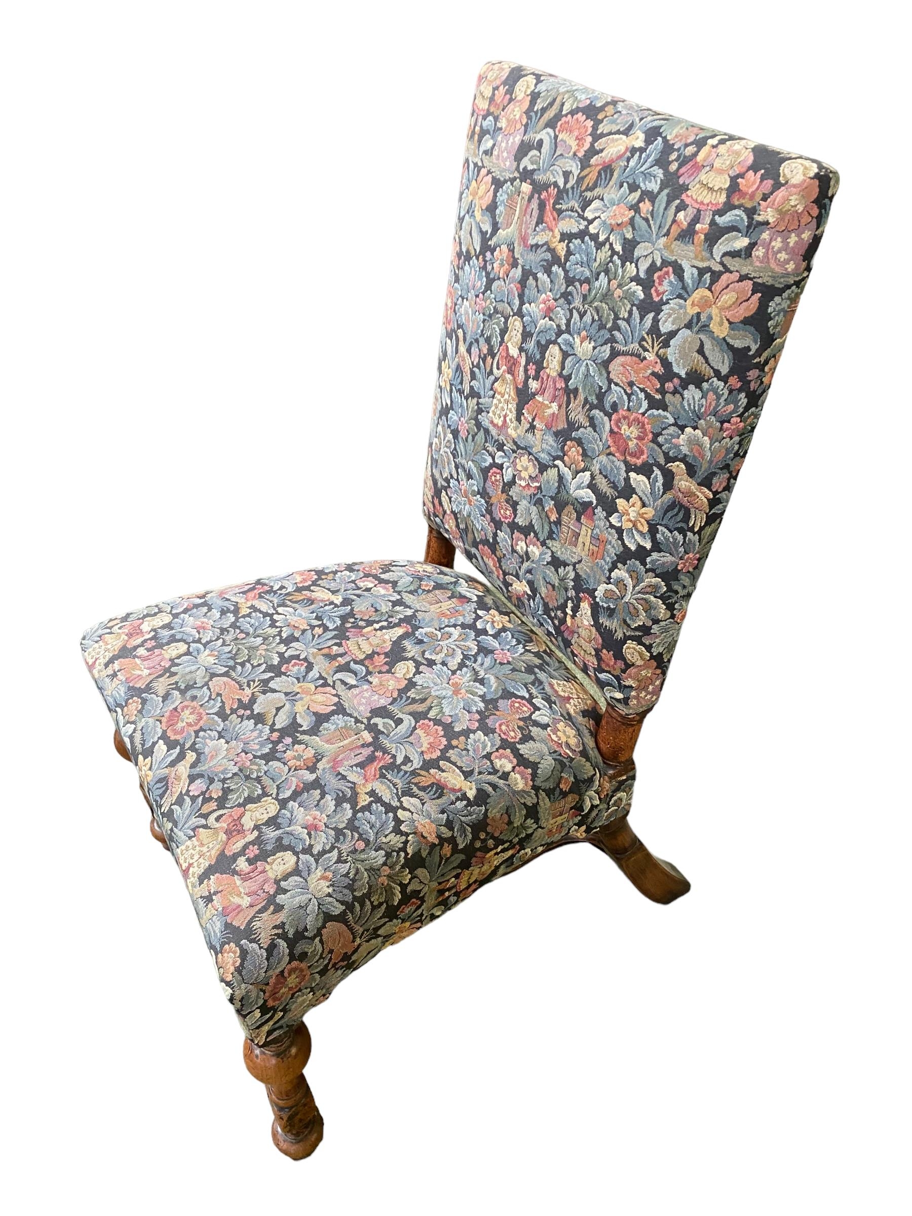 A late C19th/early C20th straight back upholstered chair, turned legs with curved X stretchers,