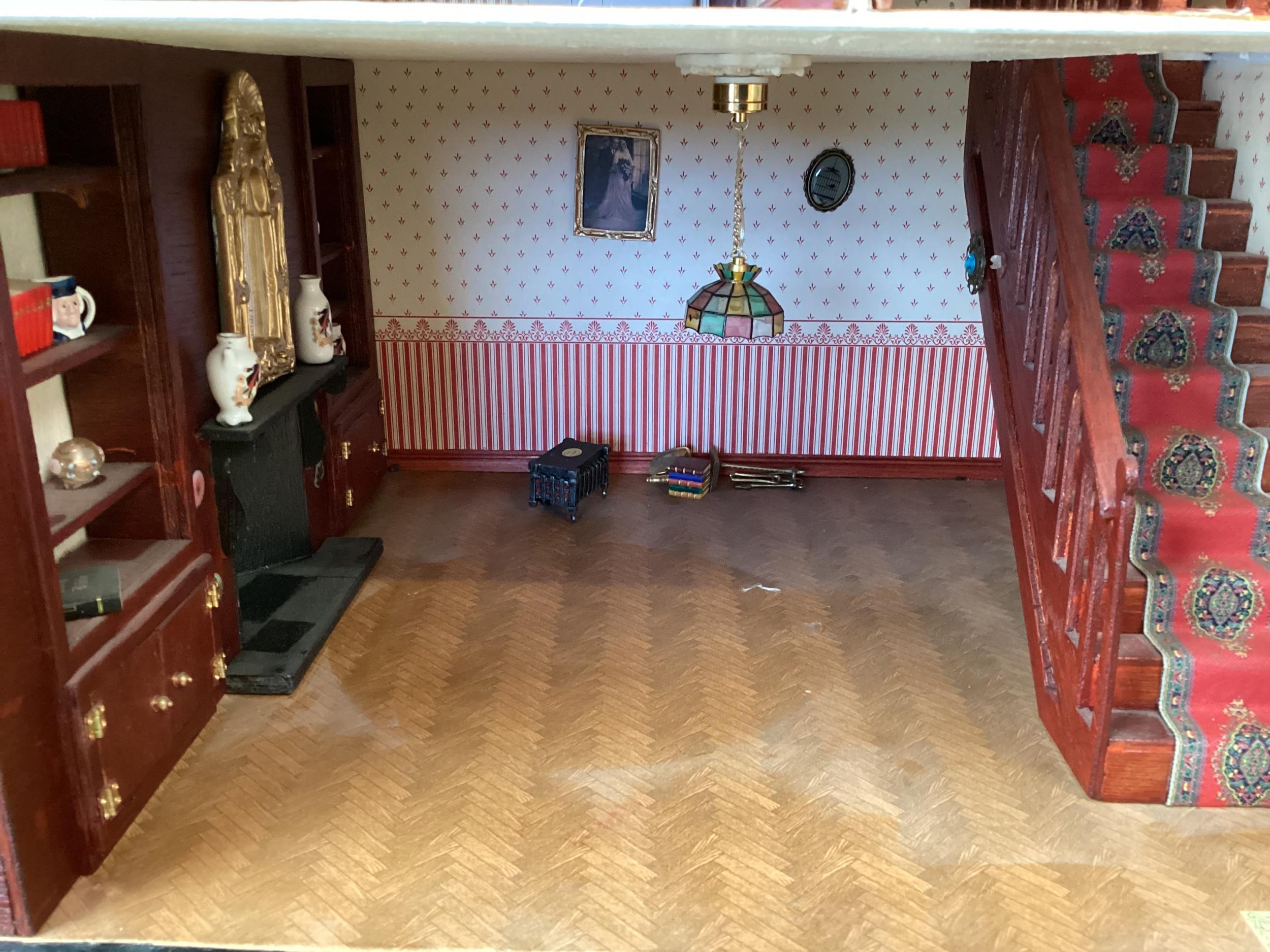 A large well fitted dolls house with numerous accessories and a large quantity of furniture, rugs - Image 7 of 16