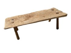 A large rustric wooden pig bench on later tapered splayed supports (signs of previous old worm), 145