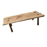 A large rustric wooden pig bench on later tapered splayed supports (signs of previous old worm), 145