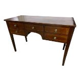 Edwardian mahogany three drawer desk/dressing table, with tapered legs, 111cm W; and another similar