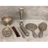 A collection of Sterling silver items to include a silver dressing set, bowl, dish, comb, etc