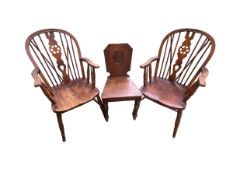 A pair of elm seat Windsor armchairs and a hall chair