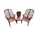 A pair of elm seat Windsor armchairs and a hall chair