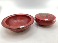 Two Chinese C19th style red lacquer items to include a circular lidded bowl with gilt decoration and