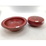 Two Chinese C19th style red lacquer items to include a circular lidded bowl with gilt decoration and