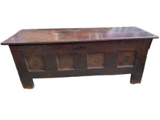 A large part C18th plank top coffer with 4 carved panels on square decorated legs 181cm x 71 x 64cm