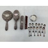Collection of Stirling silver items to include a dressing set, collection of coffee spoons with bean