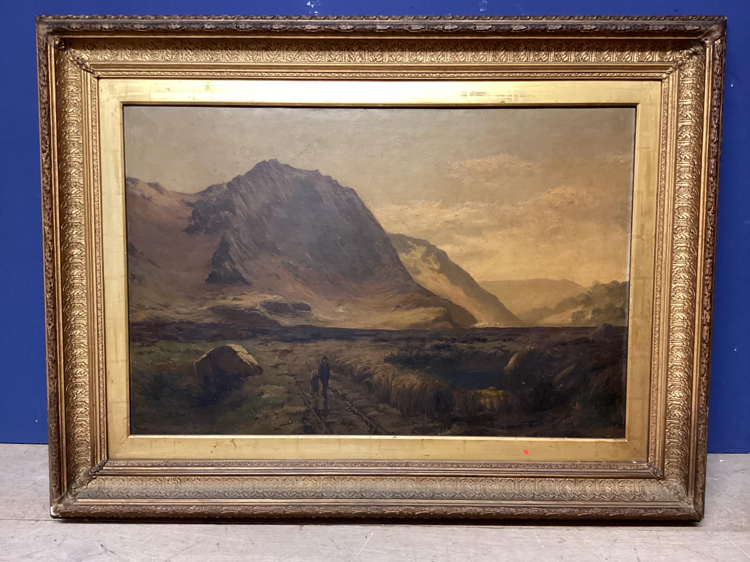 A Scottish School, oil on canvas, two figures walking in a highland scene, in a recessed carved gilt