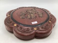 A Chinese C19th Style round lacquered sectional box with lid bearing faded out figures, 41 x 7xm