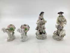 Pair of Derby Porcelain figures, gentleman playing bagpipes together with a lady carrying flowers