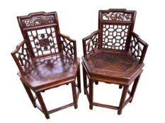 A near pair of C19th Style Chinese armchairs, pierced and carved backs, on hexagonal seat, with