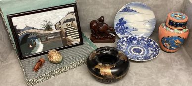 A collection of oriental items to include a lidded urn, carved buffalo, framed silk picture,