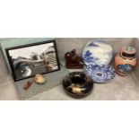 A collection of oriental items to include a lidded urn, carved buffalo, framed silk picture,