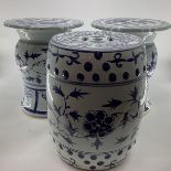 A pair of Oriental style ceramic blue and white garden or conservatory seats with Dragon