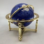A Lapis style globe mounted with minerals and semi precious stones in gilt wire settings, with