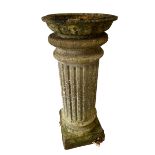 A weathered garden Pestel column, with circular bird bath to top 101cm high