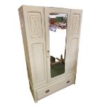 A C20th chalk painted wardrobe, central mirrored door, flanked by two cupboard doors, with single