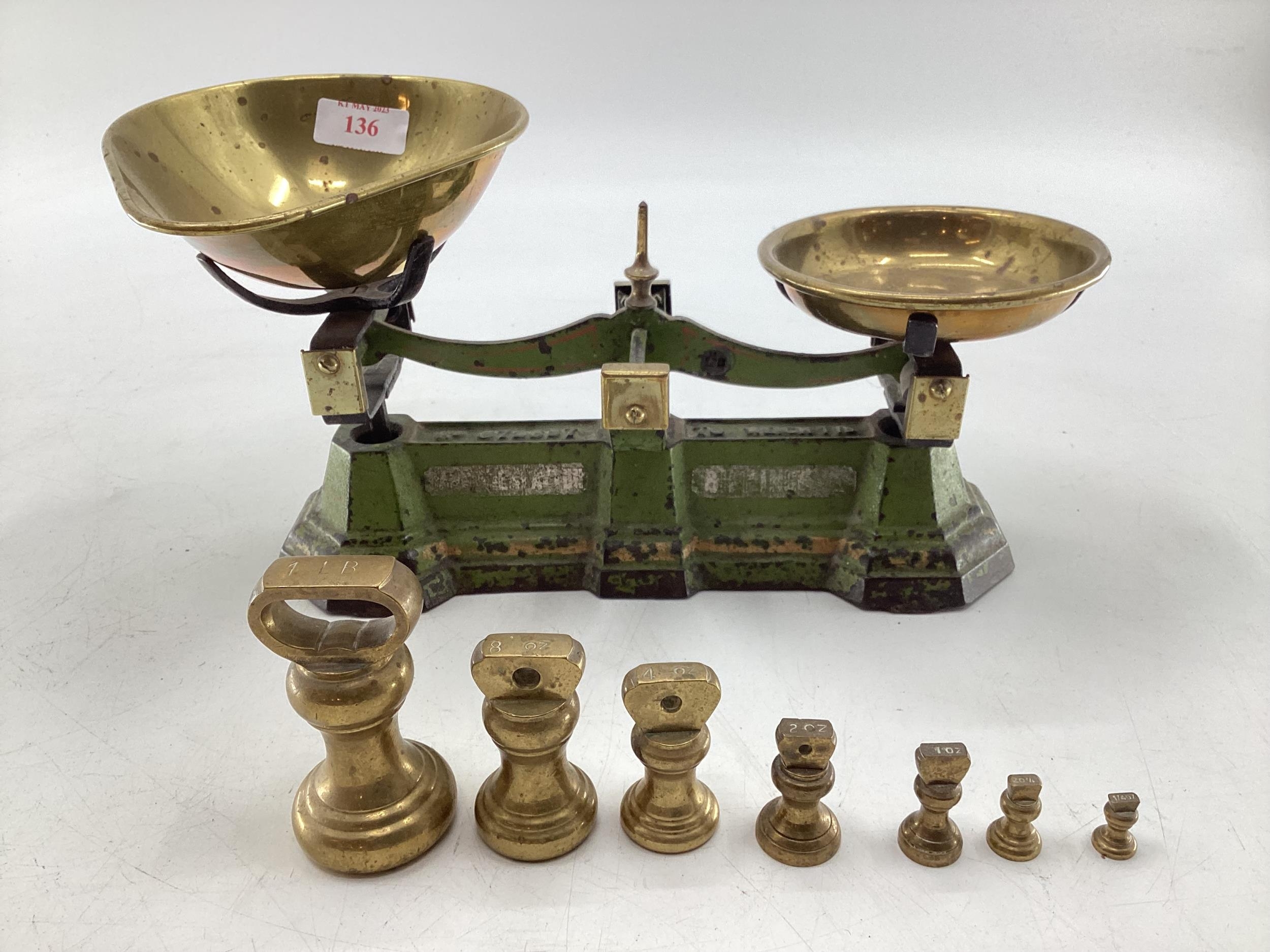 A set of metal scales, brass pans and weights, 30cm W not tested