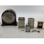 Collection of 4 carriage clocks, and a 1930s 8 day mantle clock with Bakerlight case
