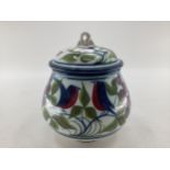 Alan Caiger-Smith, lidded vase with stylised bird and fruit decoration, monogrammed to base, 22cm