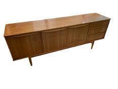 A modern suite of furniture, including a long low side cabinet - (G plan), of 198cm W x 46cmD x 74