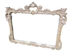 A modern wall mirror, with decorative frame of scrolling foliage, 86H x 109W cm