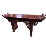 A C19th style Chinese alter table with carved and pierced fretwork decoration, 171 x 94 x 48cm