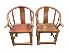 A pair of C19th style Chinese hardwood horse shoe arm chairs, S-shaped slat back with carved